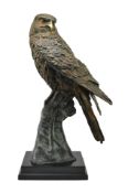 CAST BRONZE FIGURE OF AN EAGLE RAISED ON HANDLER'S GLOVE