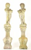 PAIR OF 20TH CENTURY RECONSTITUTED STONE GARDEN CHERUBS SCULPTURES