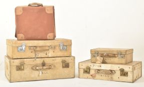 FOUR EARLY 20TH CENTURY PAPER VELLUM TRAVELLING SUITCASES & A CASE