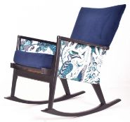 PARKER KNOLL MID CENTURY 1970S EBONISED TEAK & NEWLY UPHOLSTERED ROCKING ARMCHAIR