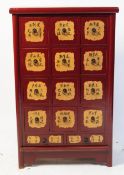 CONTEMPORARY RED LACQUERED FAUX CHINESE MERCHANTS CHEST OF DRAWERS