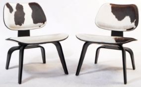 AFTER CHARLES & RAY EAMES - PAIR OF CALF HIDE EASY CHAIRS
