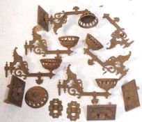 FOUR 19TH CENTURY CAST IRON WALL SCONCES