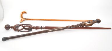 TWO MID CENTURY SOUTH AFRICAN CARVED STICKS