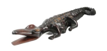 20TH CENTURY CARVED HARDWOOD FIGURE OF A CROCODILE