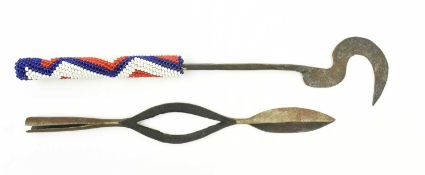 A MID CENTURY AFRICAN TUTSI RWANDA DANCE SICKLE & A CAMAROON SPEAR HEAD