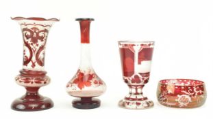 FOUR BOHEMIAN RUBY GLASS DECORATIVE ITEMS & VASES