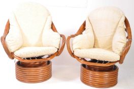 AFTER FRANCO ALBINI - TWO 20TH CENTURY BAMBOO SWIVEL CHAIR
