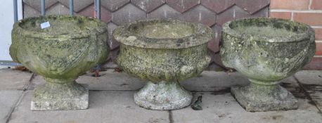 COLLECTION OF THREE STONE COMPOSITE CAMPANA GARDEN PLANTERS