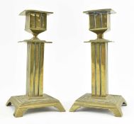 PAIR OF EARLY 20TH CENTURY BRASS URN SHAPED COLUMN CANDLESTICKS