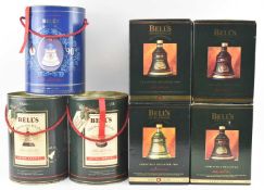 SIX 1990 TO 1995 BELL'S CHRISTMAS WHISKY DECANTER T/W ANOTHER