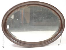 VINTAGE 20TH CENTURY OVAL WALL HANGING MIRROR