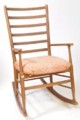 MANNER OF SCANDART - MID CENTURY ROCKING CHAIR