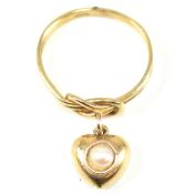 GOLD KNOT RING WITH PEARL SET HEART PENDANT
