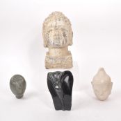 COLLECTION OF FOUR STONE FIGURE HEADS