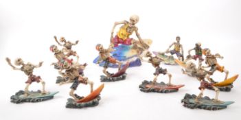 COLLECTION OF CONTEMPORARY SURFING SKELETON RESIN FIGURES
