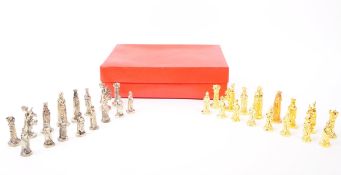 20TH CENTURY SILVERED AND GILT METAL CHESS PIECES