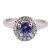 HALLMARKED 950 PLATINUM TANZANITE & DIAMOND HALO RING