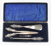 EARLY 20TH CENTURY DRESSING SET - SHOEHORN, GLOVE STRETCHER & BUTTON PULLER