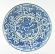 EARLY 20TH CENTURY CHINESE BLUE AND WHITE DRAGON CHARGER