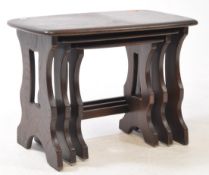 ERCOL FURNITURE 1982 - NEST OF THREE DARK ELM TABLES