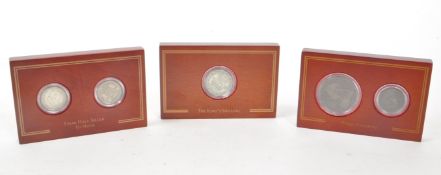 THREE WOOD FRAMED COIN PRESENTATION BLOCKS
