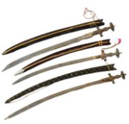 THREE EARLY 20TH CENTURY INDIAN TULWAR SWORDS