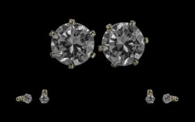 Fine Pair of 18ct Gold Single Stud Diamond Earrings. Marked 750 - 18ct. The Round Modern Brilliant