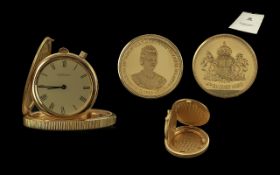 18 CARAT GOLD GARRARD & CO LIMITED EDITION COMMEMORATIVE COIN WATCH A gold commemorative coin watch,