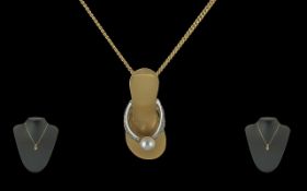 Ladies Contemporary Design Quality 18ct Gold Diamond and Pearl Set Pendant in the form of a ladies
