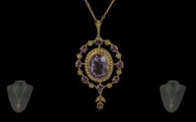 Late Victorian Period Pleasing Quality Ladies 9ct Gold Open worked Pendant Drop Set with Amethysts
