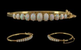 Victorian Period 1837 - 1901 Ladies 15ct Gold Opal Set Hinged Bangle with Safety Chain. Marked 15ct.