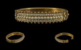 Victorian Period 1837 - 1901 15ct Gold Triple Row Pearls Set Hinged Bangle of Pleasing Design,