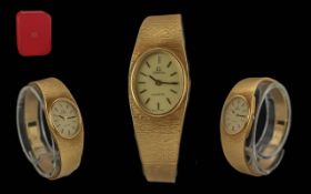Omega Ladies 18ct Gold Quartz Wrist Watch with Integral Bracelet. Marked 750 - 18ct.