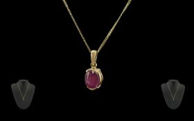 Ladies 18ct Gold Royal Ruby Set Pendant Drop Attached to a 18ct Gold Chain.