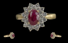 Ladies 14ct Gold Diamond and Ruby Set Cluster Ring, The Central Oval Shaped Ruby of Excellent Colour