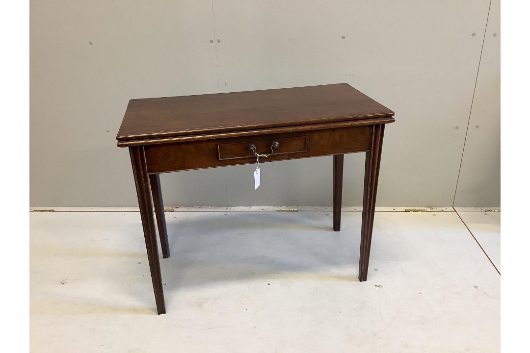 A George III rectangular mahogany folding tea table, width 92cm, depth 45cm, height 73cm - Image 1 of 2