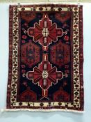 A Turkish blue ground rug, 144 x 102cm