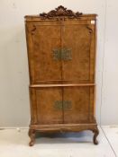 A Queen Anne Revival walnut cocktail cabinet, width 80cm, depth 40cm, height 167cm