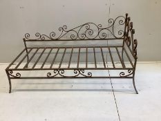 A wrought iron daybed, width 144cm, depth 60cm, height 80cm