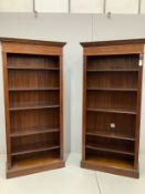 A pair of reproduction Edwardian style inlaid mahogany open fronted bookcases, width 89cm, depth