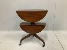 A Regency circular mahogany two tier drop flap occasional table, diameter 63cm, height 76cm