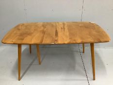 An Ercol elm and beech rectangular extending dining table, 224cm extended, width 88cm, height 71cm