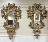 A pair of 18th century style carved giltwood wall mirrors, width 64cm, height 114cm