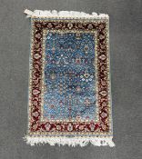A North West Persian part silk blue ground mat, 90 x 60cm.