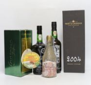 A bottle of Gilberts Port, a boxed Moet & Chandon 2004, a White Port boxed, a Courvoisier and a