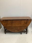 An 18th century and later oval oak gateleg dining table, length 173cm extended, depth 140cm,