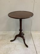 A George III style circular mahogany tripod wine table, diameter 48cm, height 72cm