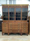A large George IV and later inlaid mahogany library bookcase with parcel gilt pediment, width 182cm,