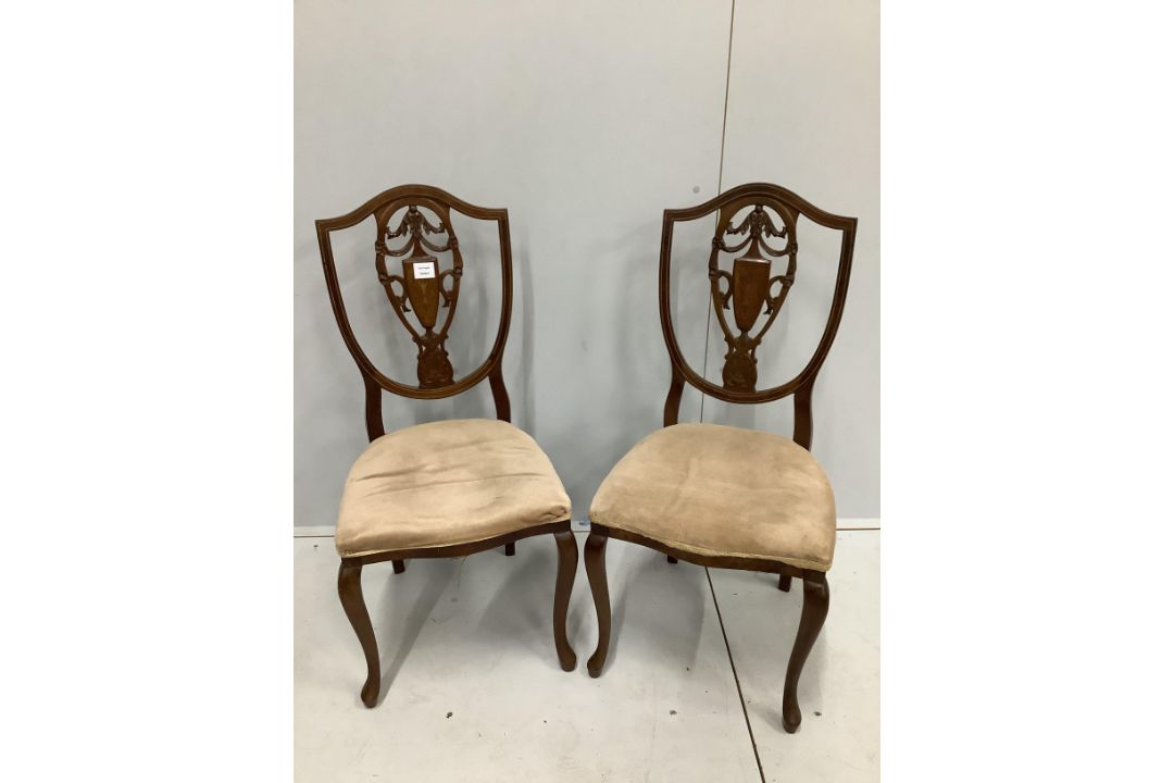 A pair of Edwardian inlaid mahogany shield back side chairs